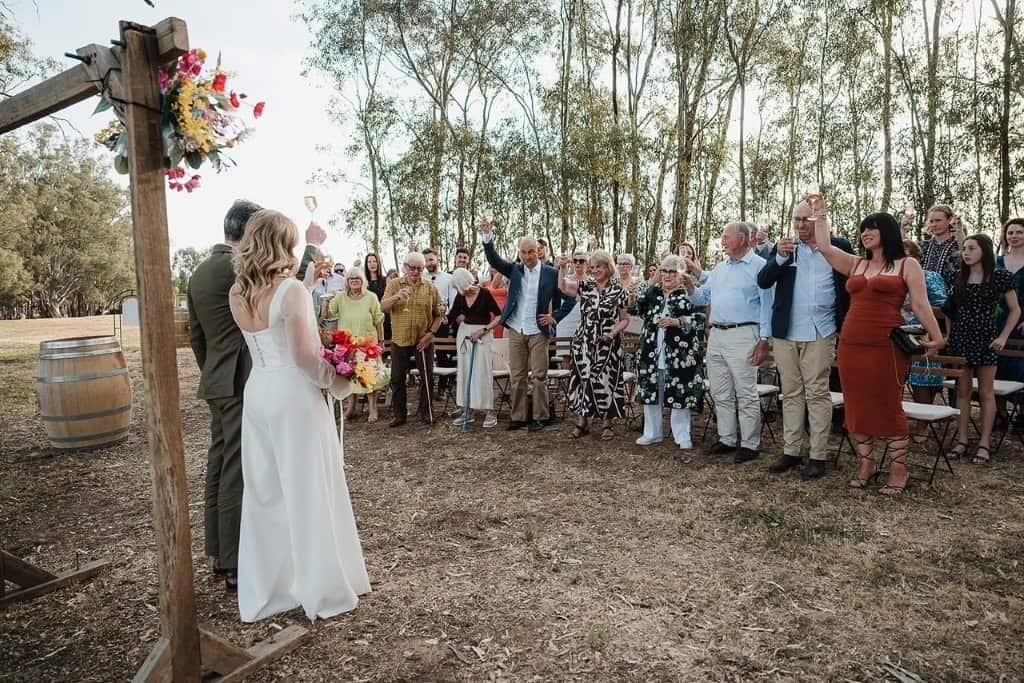 guests toast wedding ceremony Squires Winery Andrea Sissons Photography